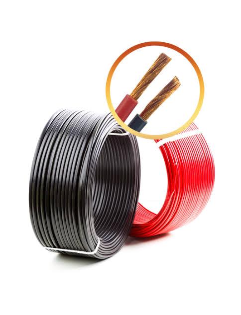 Coils of red and black double-core solar DC cable with a close-up of the stranded copper conductors