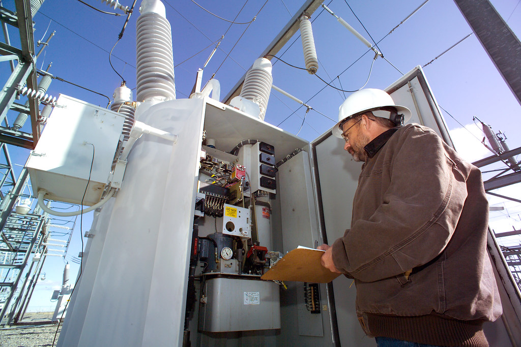 Engineer inspecting equipment at an electrical substation